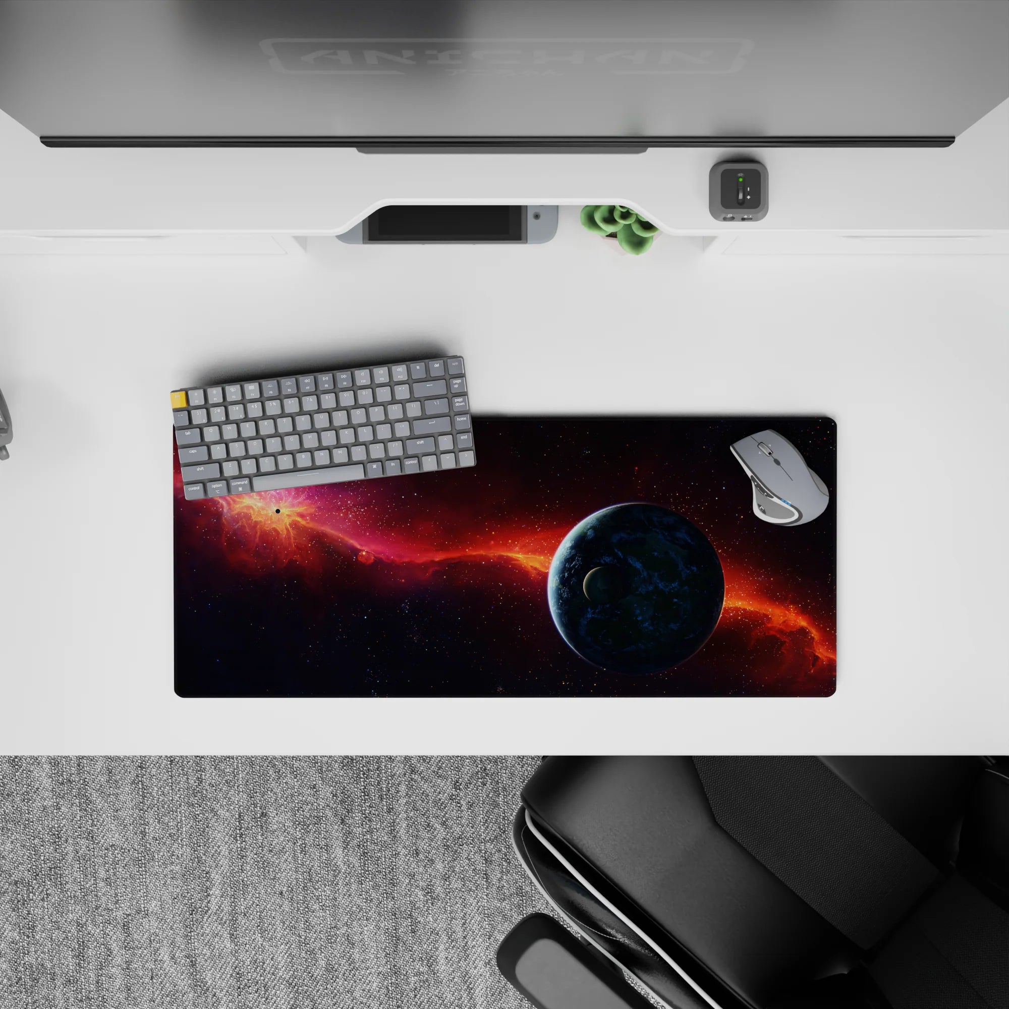 Moody purple-to-midnight desk mouse pad 28x12 inches with fiery orange nebula for cozy late-night vibes.