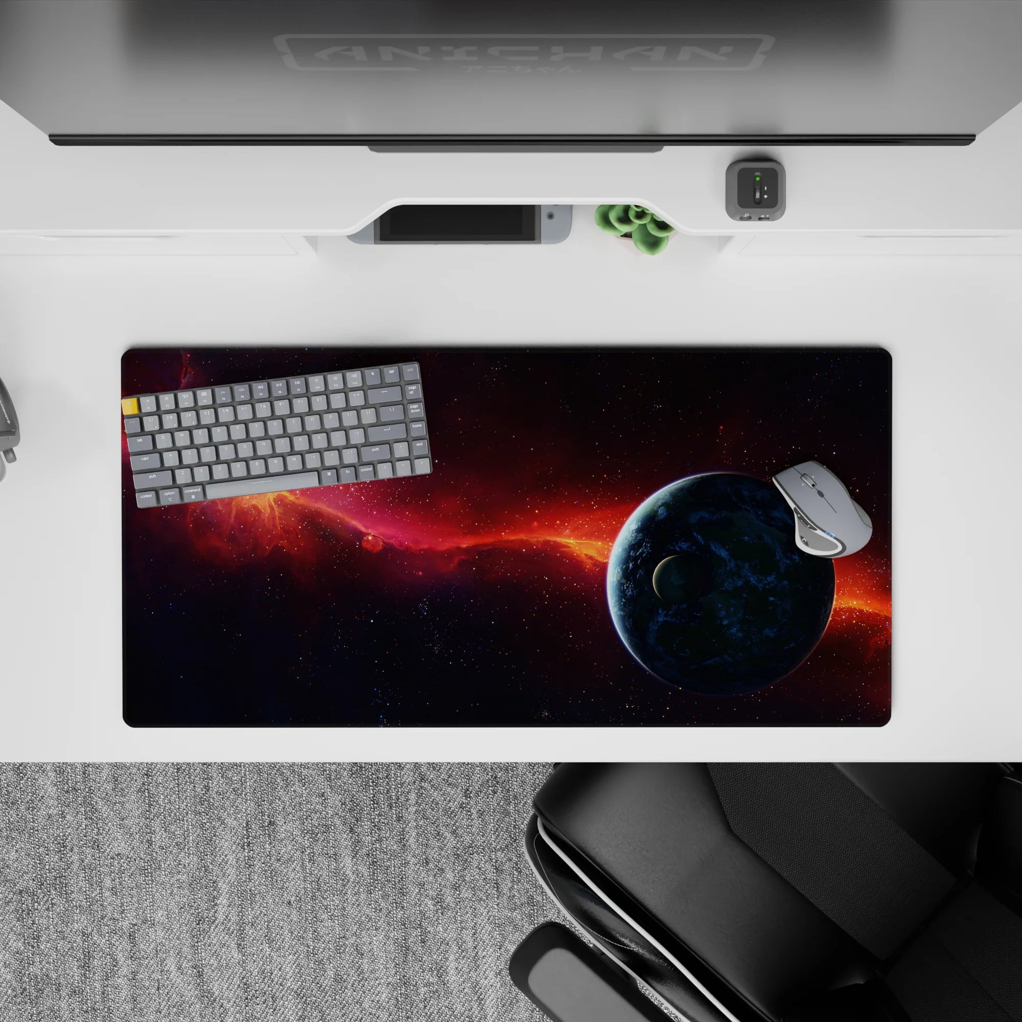 Moody cosmic mouse pad 32x16 inches in smoky purples, midnight blues, and a fiery orange nebula streak.
