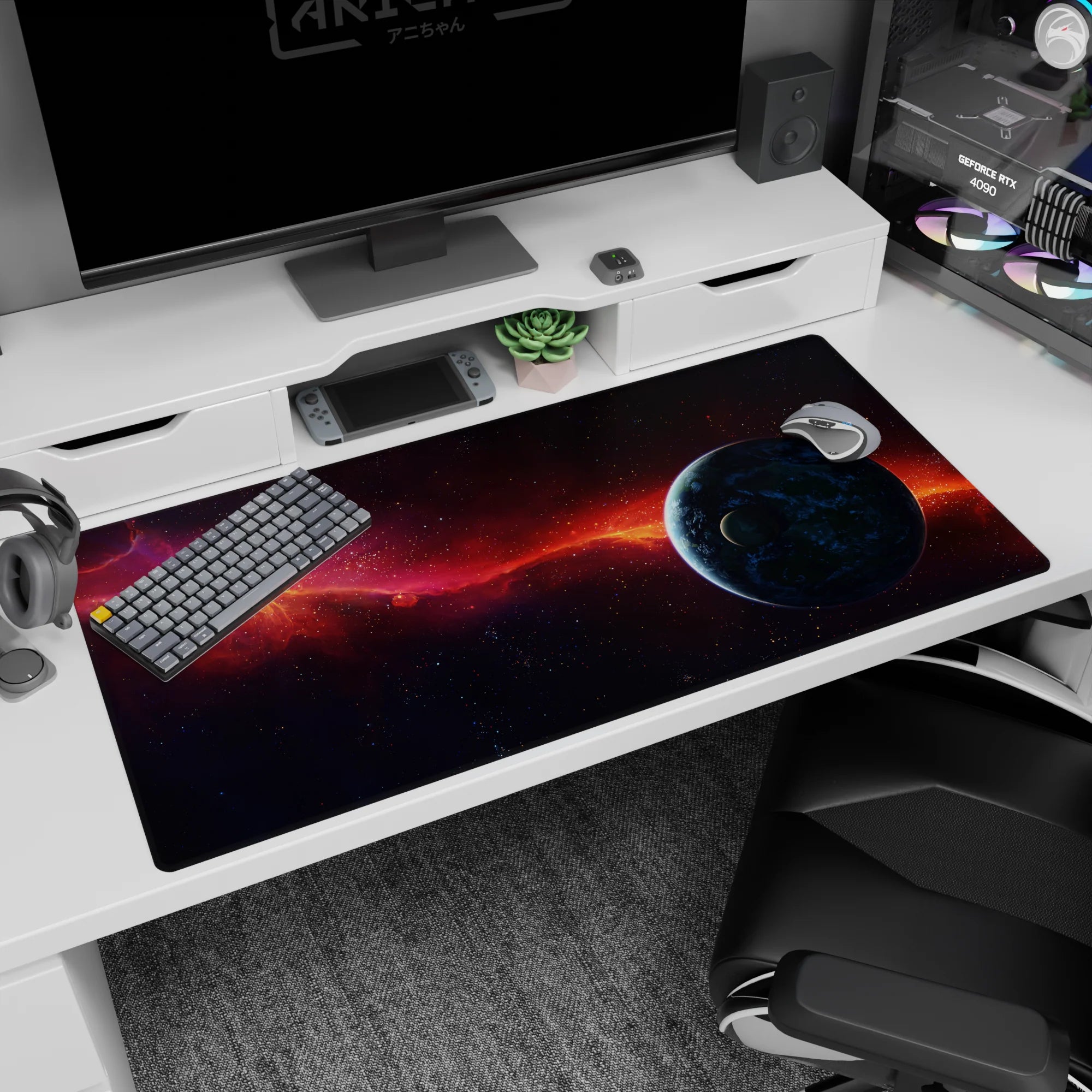 Starfield desk pad 40x20 inches featuring a blue planet at the edge and a comet-like orange ribbon.