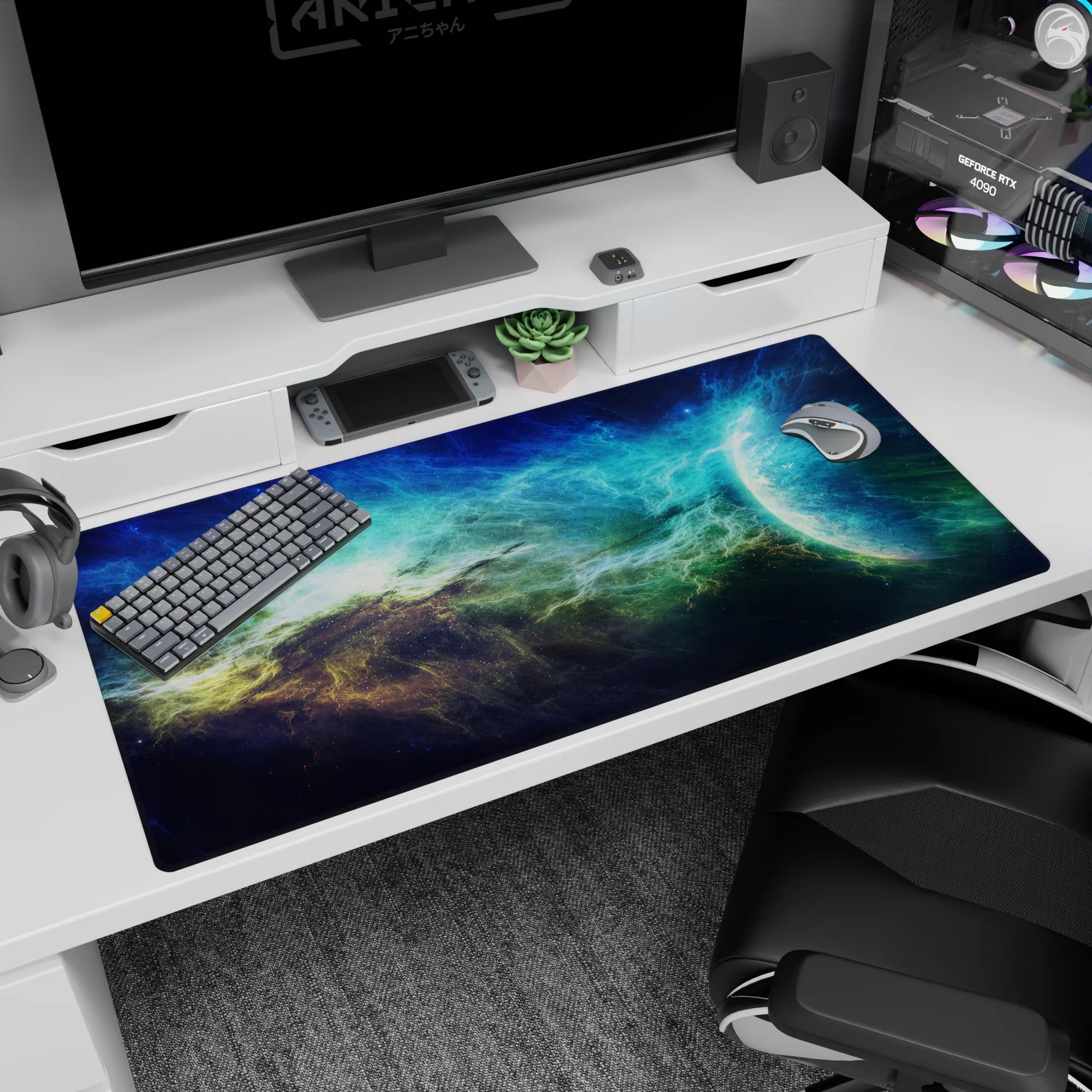 Space scene desk pad 40x20 inches featuring teal cloud nebula over navy space and a cool blue planet.