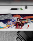 36x16 inches anime desk pad in crimson, gold, and indigo with festival-night glow and sparkling fireworks.