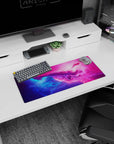 Starry nebula scene mouse pad 28x12 inches with swirling color waves and subtle sparkle.