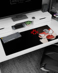 Angry chibi anime girl punching the air with red rage symbol on a desk pad, 36x16 inches.
