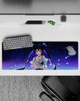 Dreamy indigo anime mouse pad 32x12 inches with constellations, ruby eyes, neon-blue rose glow.