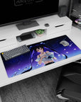 Shy ruby-eyed twin-tail anime girl on 36x16 inches desk pad, floating hair, starlit sky and petals.