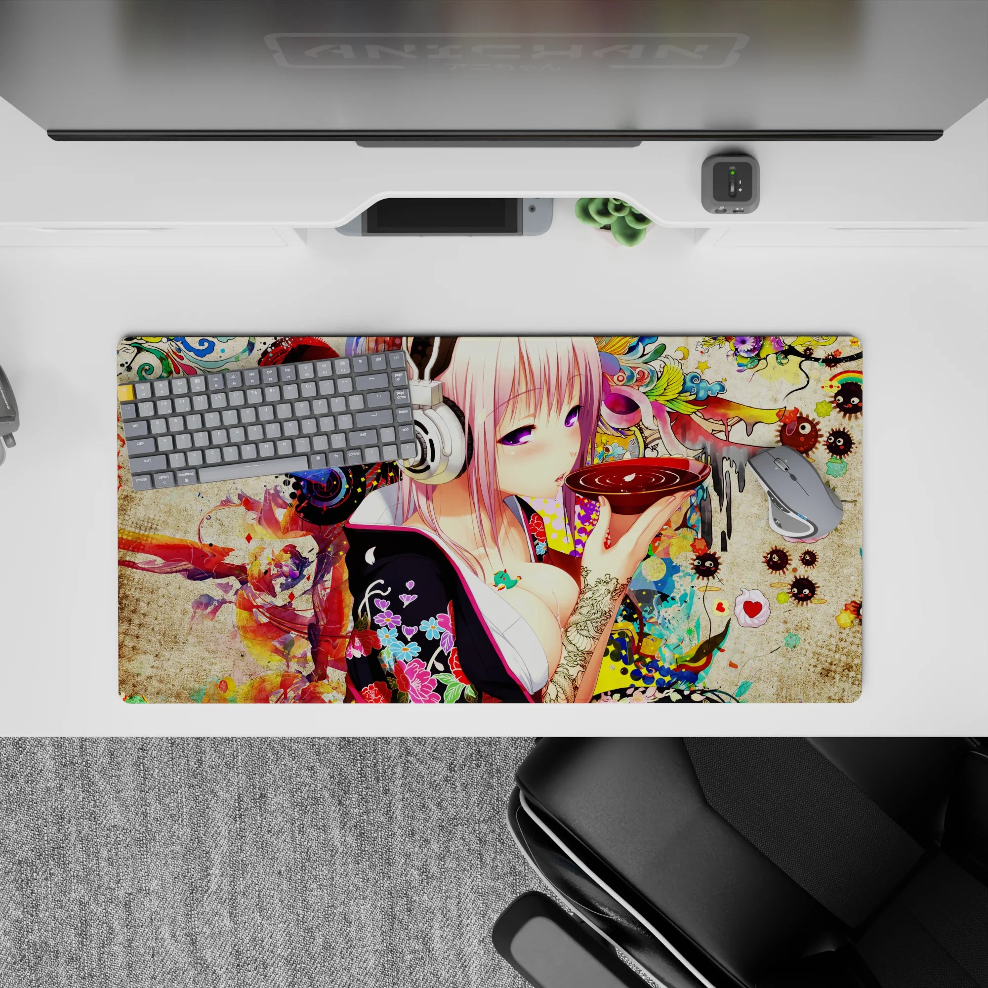 32x16 inches neon pastel desk mat in soft pink and red, late-night otaku vibe with splashes and texture.