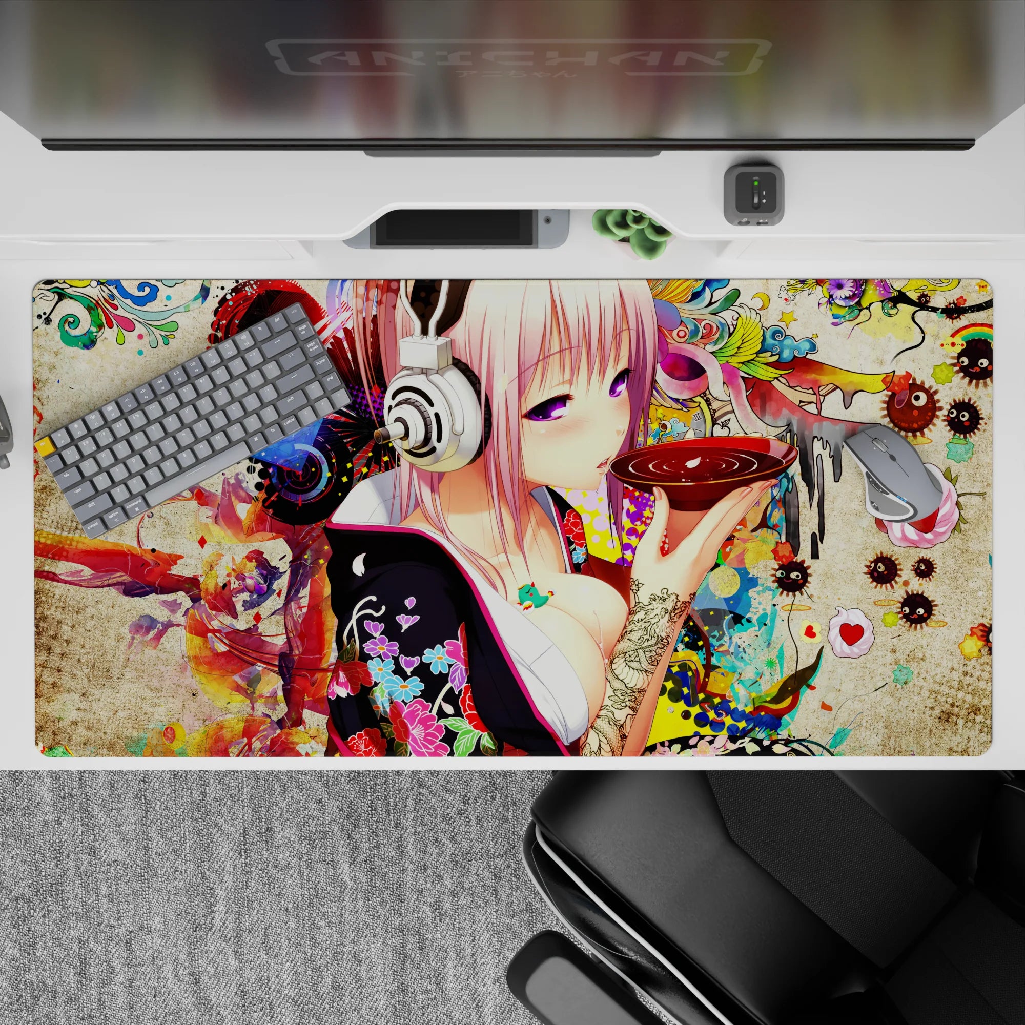 Pink neon anime desk pad 40x20 inches, late-night cozy vibe with reds, candy florals, textured backdrop.