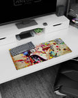 28x12 inches desk mouse pad showing pink-haired girl in silver headphones sipping from a glossy red bowl.