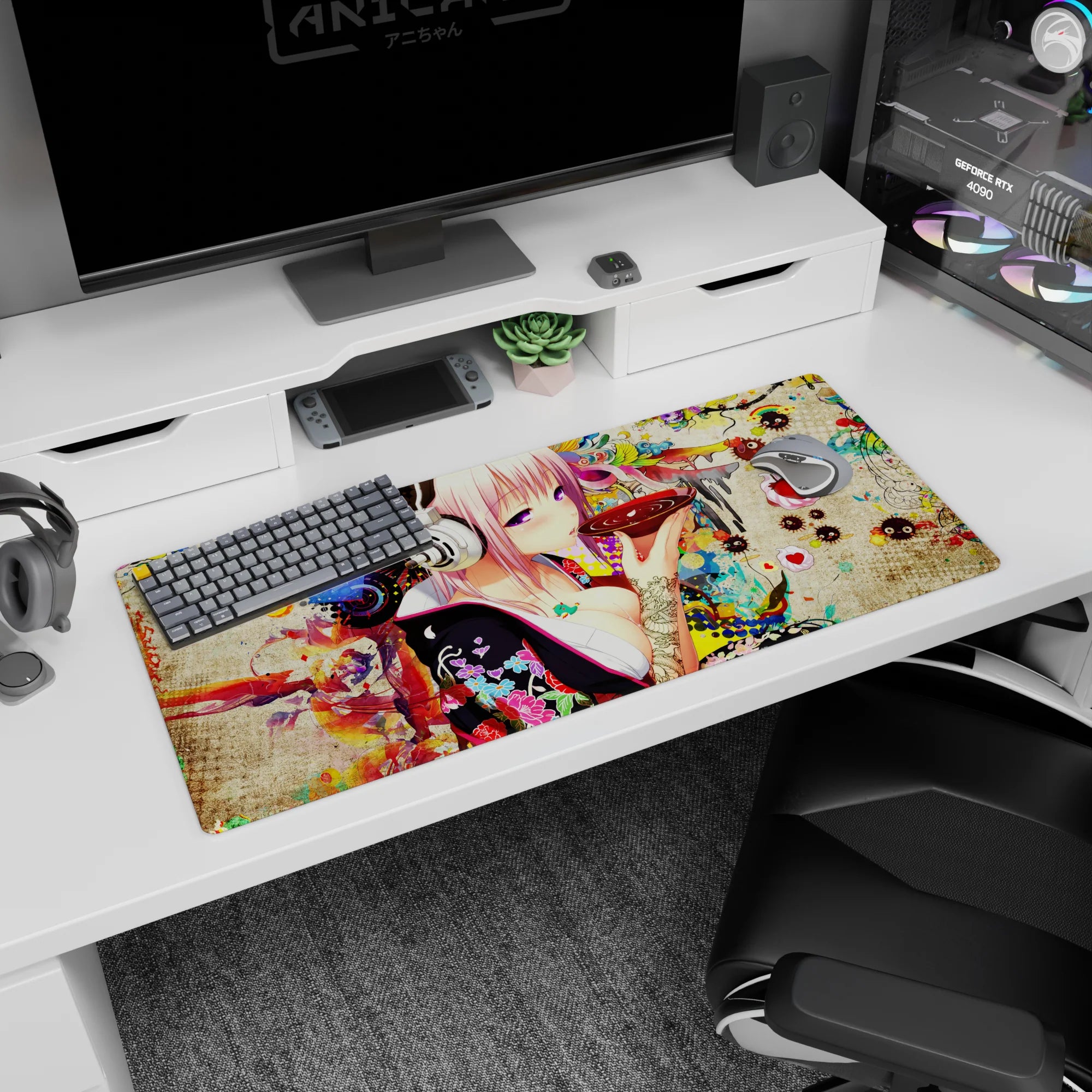 36x16 inches desk pad showing pink-haired anime girl in big silver headphones sipping from a glossy red bowl.