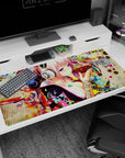 Pink-haired anime girl in silver headphones sipping from a red bowl on a 40x20 inches desk pad.