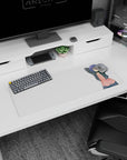 Stretching anime girl mouse pad 32x12 inches, short indigo hair, cheek marks, dangling earbuds, floating notes.