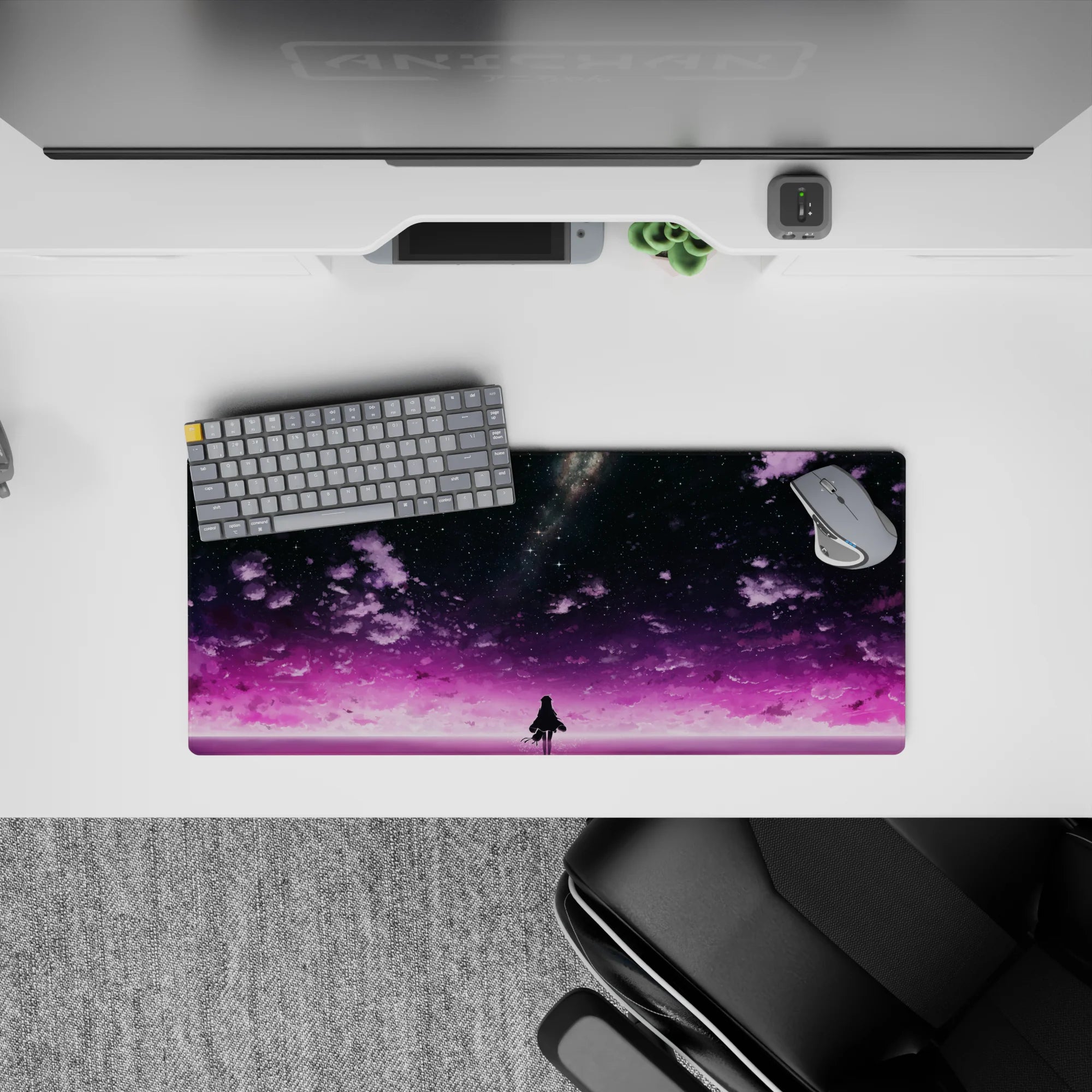 Dreamy 28x12 inches anime mouse pad in purple, pink glow, and star confetti for a calm desk vibe.