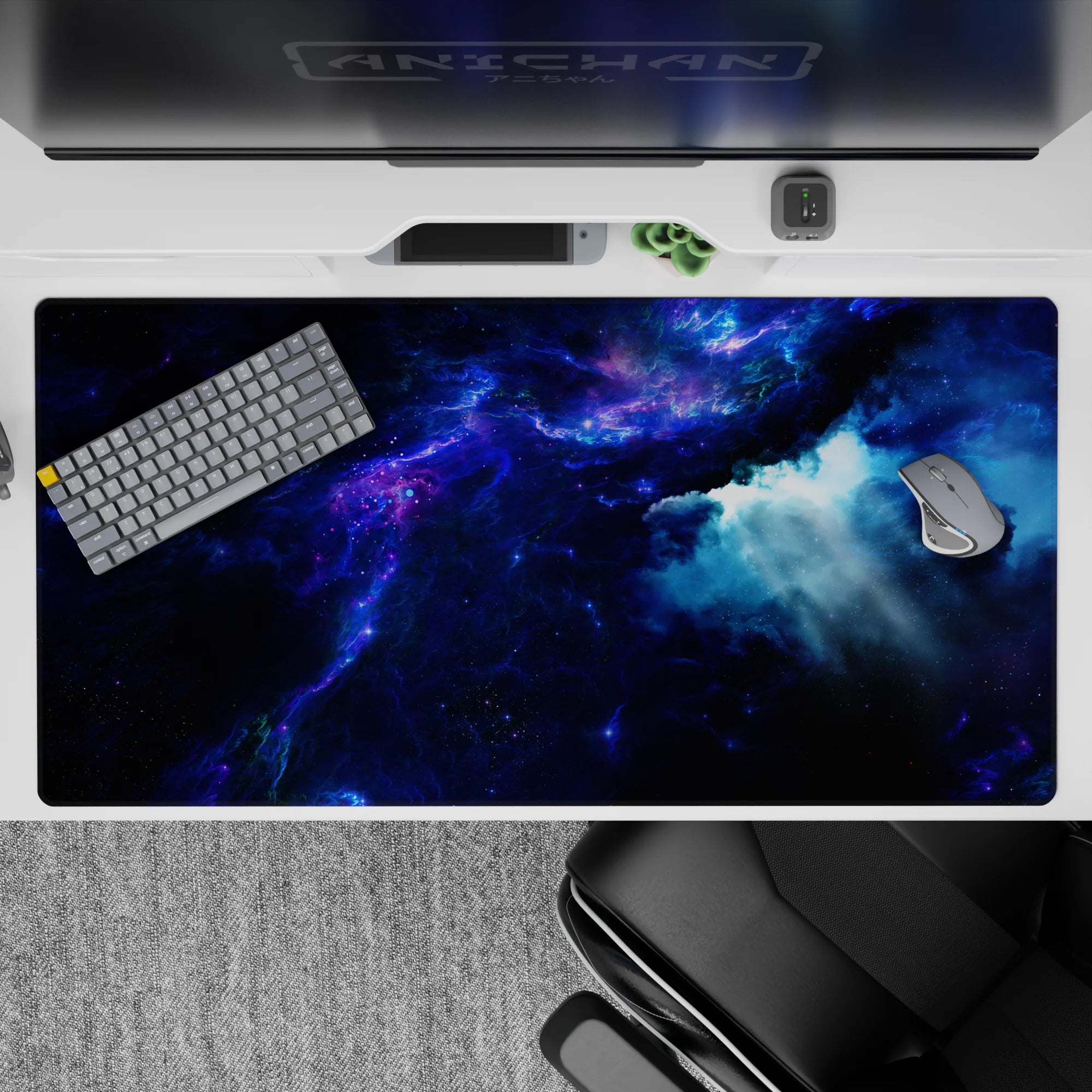 Deep navy to inky black desk pad 40x20 inches with electric blue glow and calm cosmic mood.