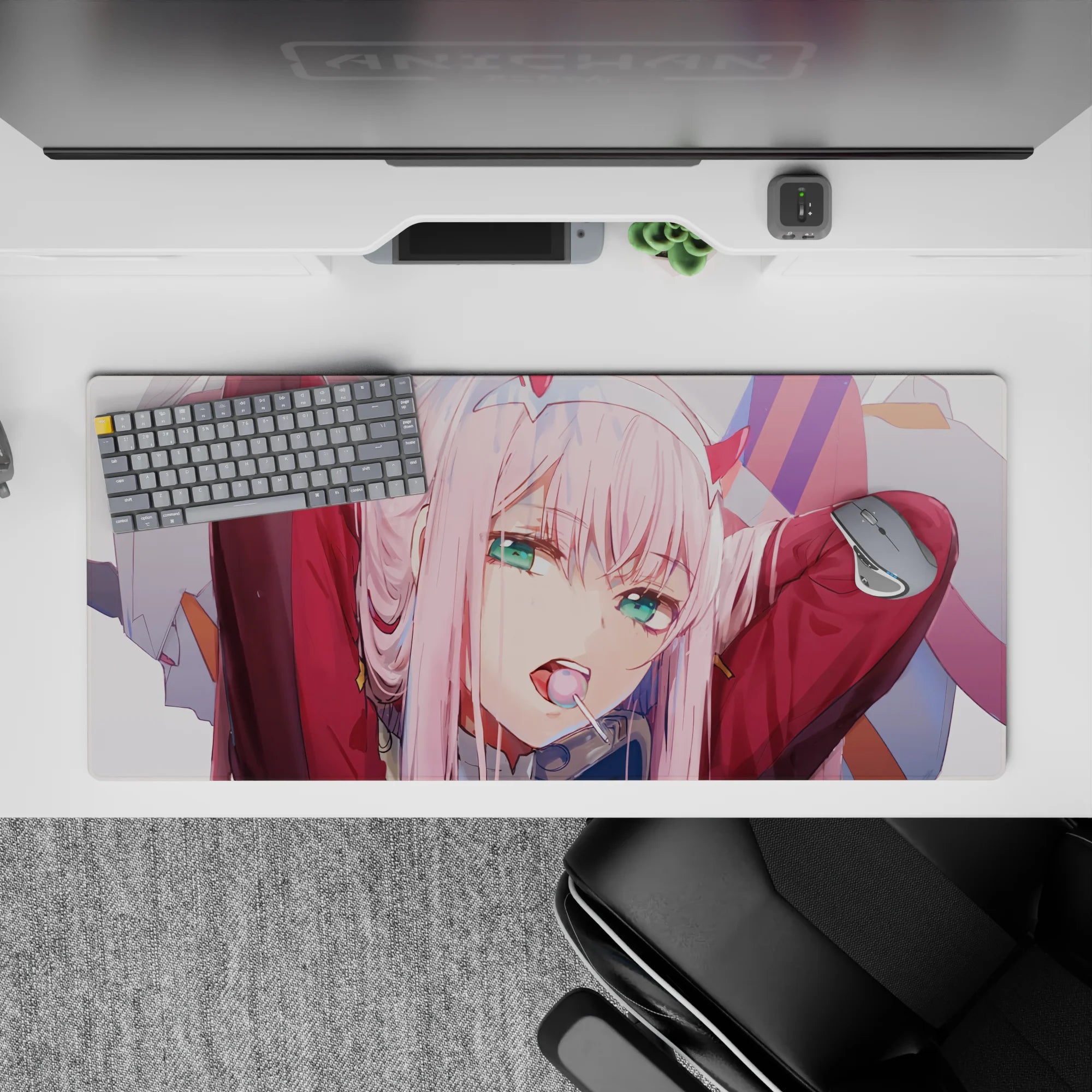 36x16 inches desk pad with Zero Two from Darling in the Franxx, highlighting her rebellious attitude and iconic lollipop in soft pink hues.