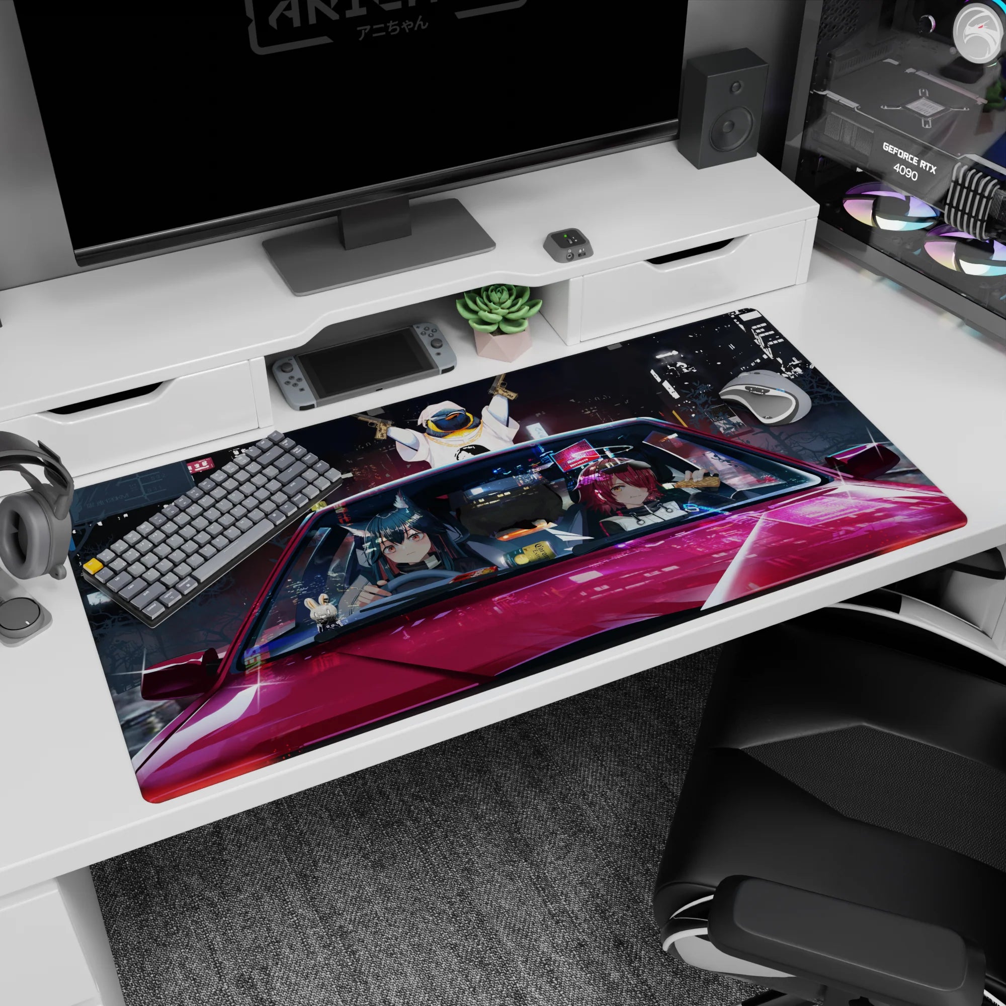 Anime girl desk pad 40x20 inches showing anime duo riding in a red car, bunny charm, city lights.