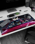 Anime girl desk pad 40x20 inches showing anime duo riding in a red car, bunny charm, city lights.