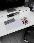 28x12 inches mouse pad showing a smiling glasses girl posing as a small UFO hovers beside her.