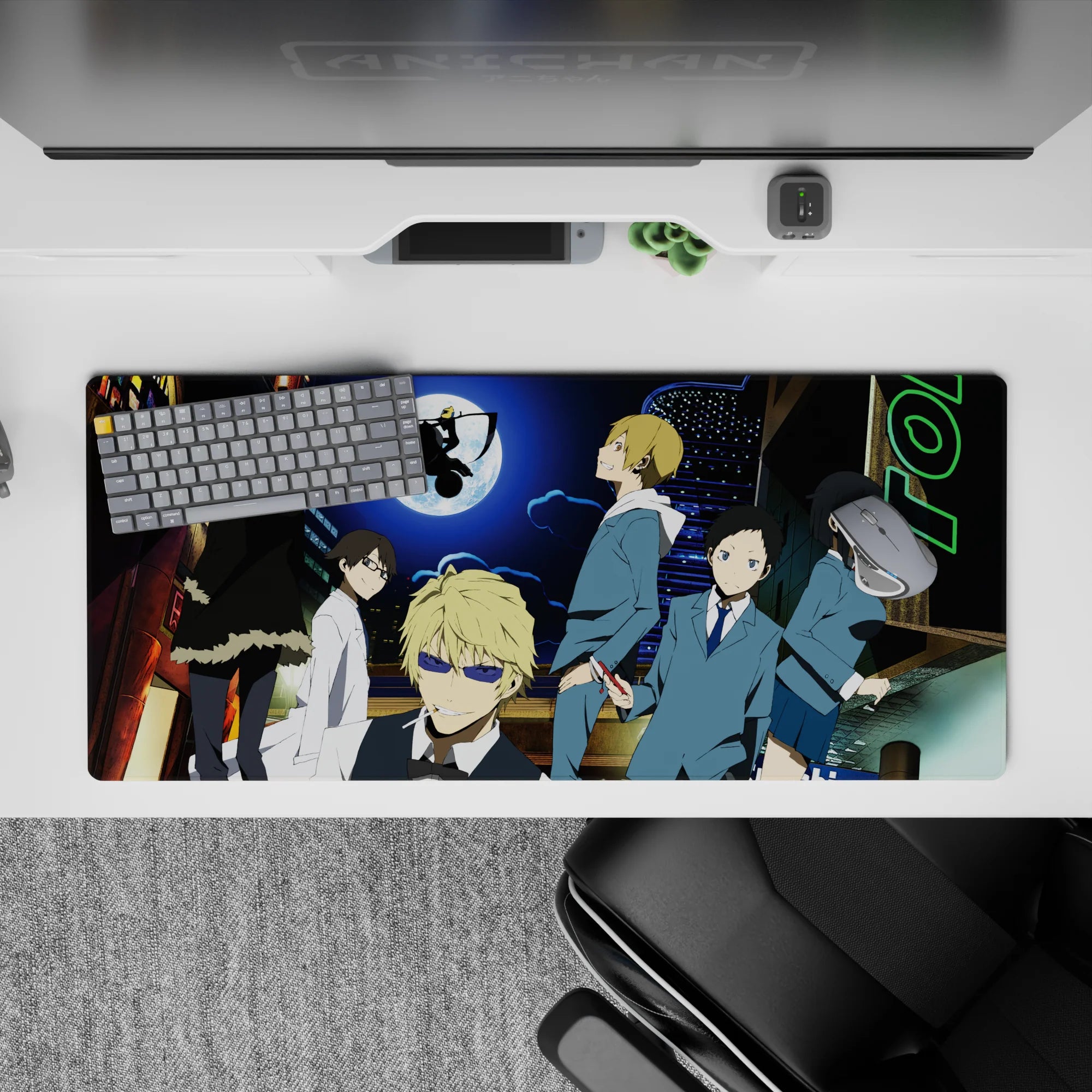 Electric blue and lime neon anime desk pad 36x16 inches, edgy night mood with moonlit street chaos.