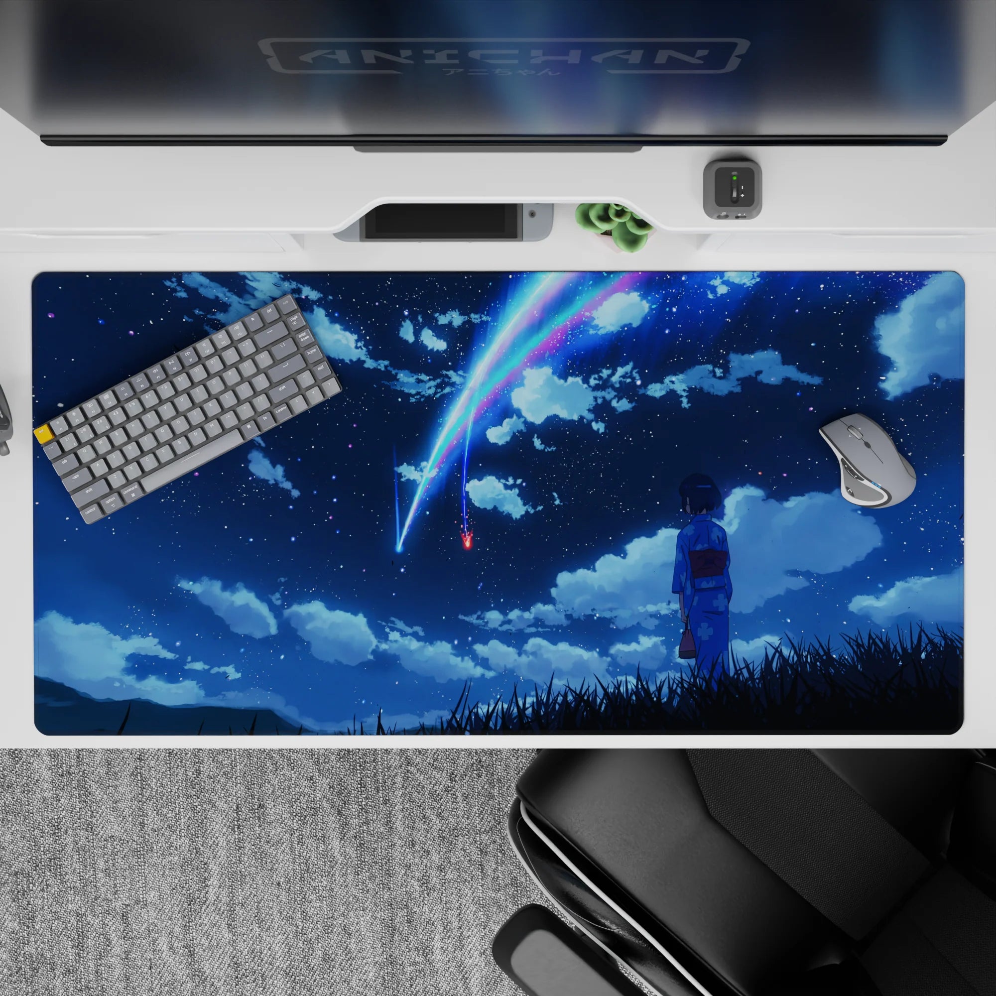 40x20 inches anime desk pad in deep navy with neon blue and pink comet trails, calm dreamy glow.