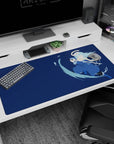 40x20 inches anime desk pad showing blue-coated swordsman mid-step, katana slash through splashing water.