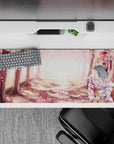 36x16 inches anime desk pad in blush pink sakura tones with warm golden glow and soft forest shadows.