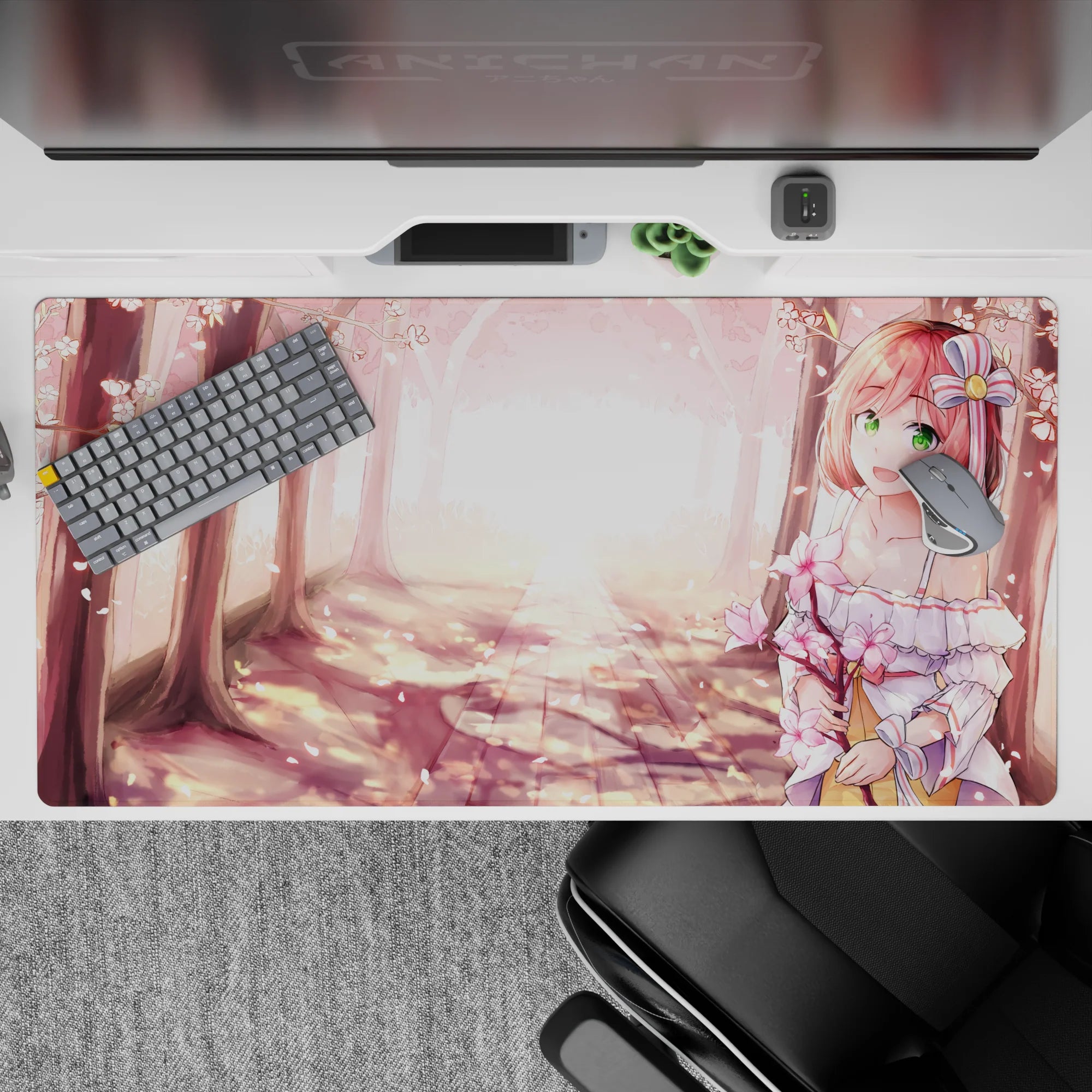 Cherry blossom anime desk pad 40x20 inches in blush pink petals and warm golden spring glow.