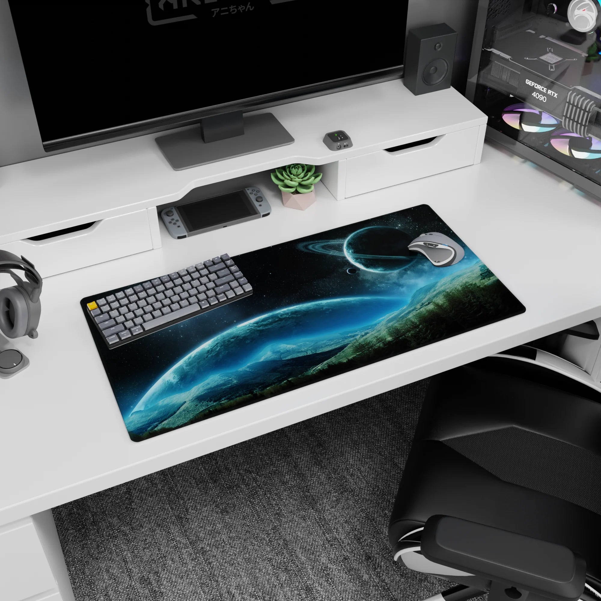 Ringed planet over misty mountain horizon mouse pad 32x16 inches under a starry night sky.