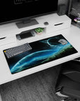 Ringed planet over misty mountain horizon mouse pad 32x16 inches under a starry night sky.