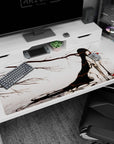 Anime girl with flowing black hair among bare ink branches and red blossoms desk pad 40x20 inches.