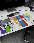 Nine anime faces in hoodies and sleek jackets across a 40x20 inches desk pad, intense stares.