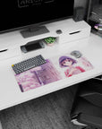 Shy anime girl with glossy dark bob and rosy cheeks under cherry blossoms mouse pad 28x12 inches.