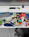 36x16 inches anime desk pad in warm oranges and icy blues, crisp lines, bold blocks, cozy vibe.