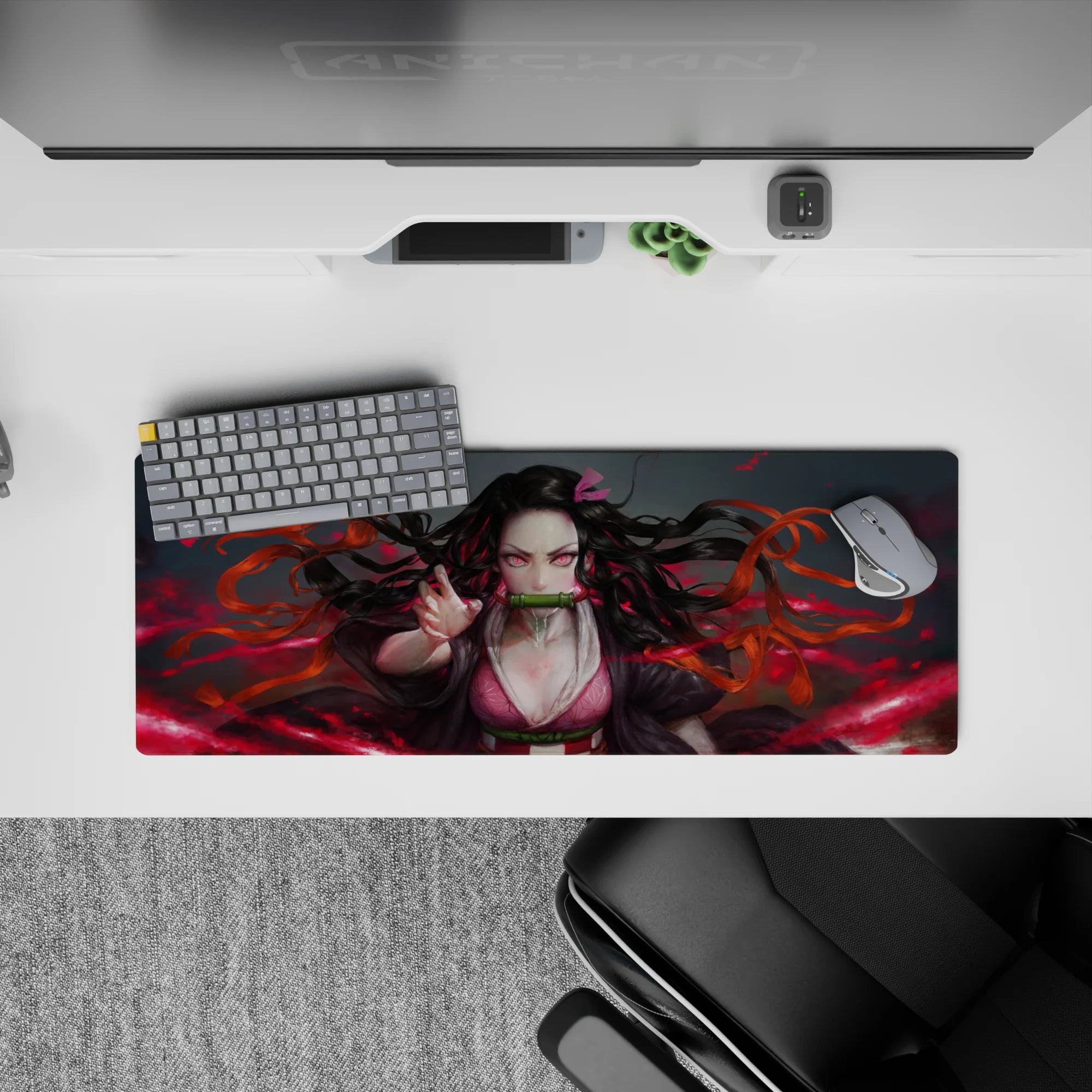 Anime mouse pad 32x12 inches featuring Nezuko with piercing pink eyes and fiery red background, perfect for desk setup.