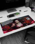 Nezuko anime desk pad 36x16 inches, featuring her fierce pink eyes and dynamic hair in a blazing red design.