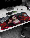 Nezuko anime desk pad, 40x20 inches, features fierce pink-eyed design with blazing red hues, adding drama to your setup.
