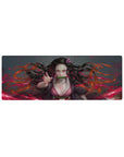 Large 32x12 inches anime mouse pad featuring Nezuko with pink eyes and dynamic hair, exuding fiery energy and strength.