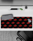 Charcoal black 32x12 inches anime desk mat with crisp red Akatsuki clouds, bold moody Naruto vibe.
