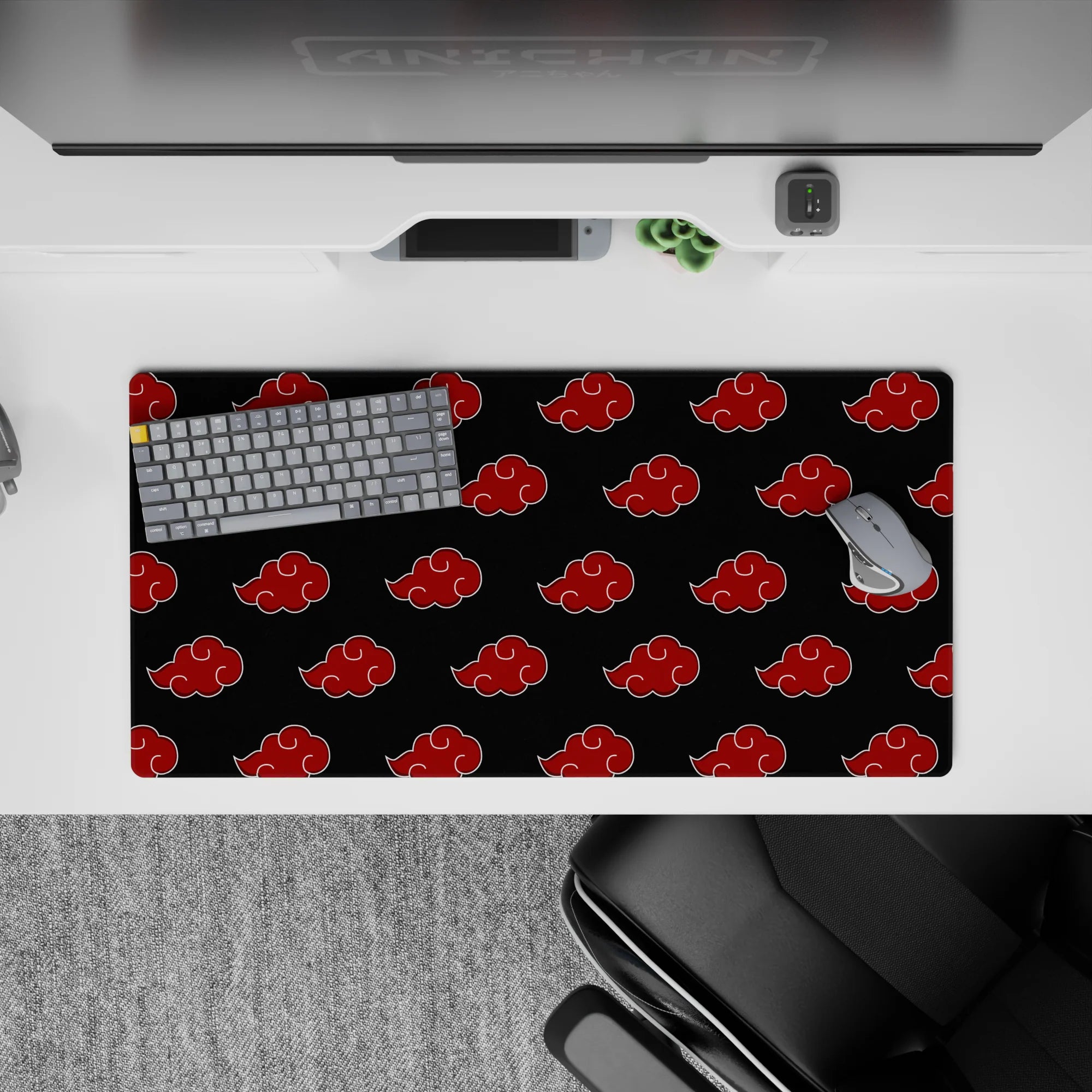 Charcoal black and candy-red cloud emblems anime desk mat, 32x16 inches, bold Naruto vibe.