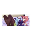 Anime girl mouse pad 28x12 inches with red-haired girl, violet eyes, headphones, on lavender bed.