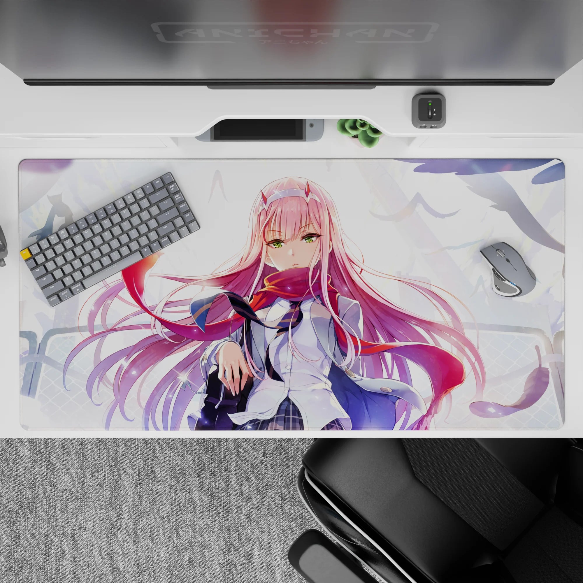 Dynamic 40x20 desk pad capturing Zero Two’s fierce emerald eyes, flowing pink hair, and windswept background for powerful vibe