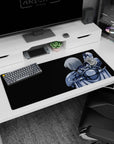 36x16 inches anime girl desk pad showing a back-view silver-haired swordswoman guarding the desk.