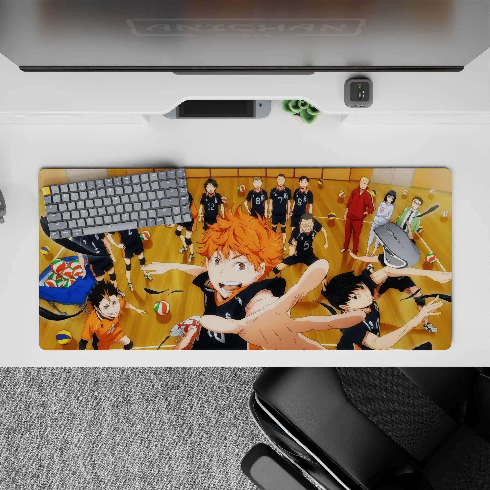 36x16 inches anime desk pad in warm wood tones, bold black uniforms, energetic team spirit vibe.