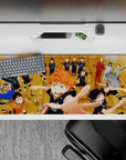 36x16 inches anime desk pad in warm wood tones, bold black uniforms, energetic team spirit vibe.