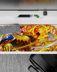 Fiery anime desk pad 36x16 inches in hot orange and neon yellow glow with molten swirls and sparks.