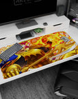 Grinning golden knight raises gauntlet before blazing fireball on anime desk pad 40x20 inches.