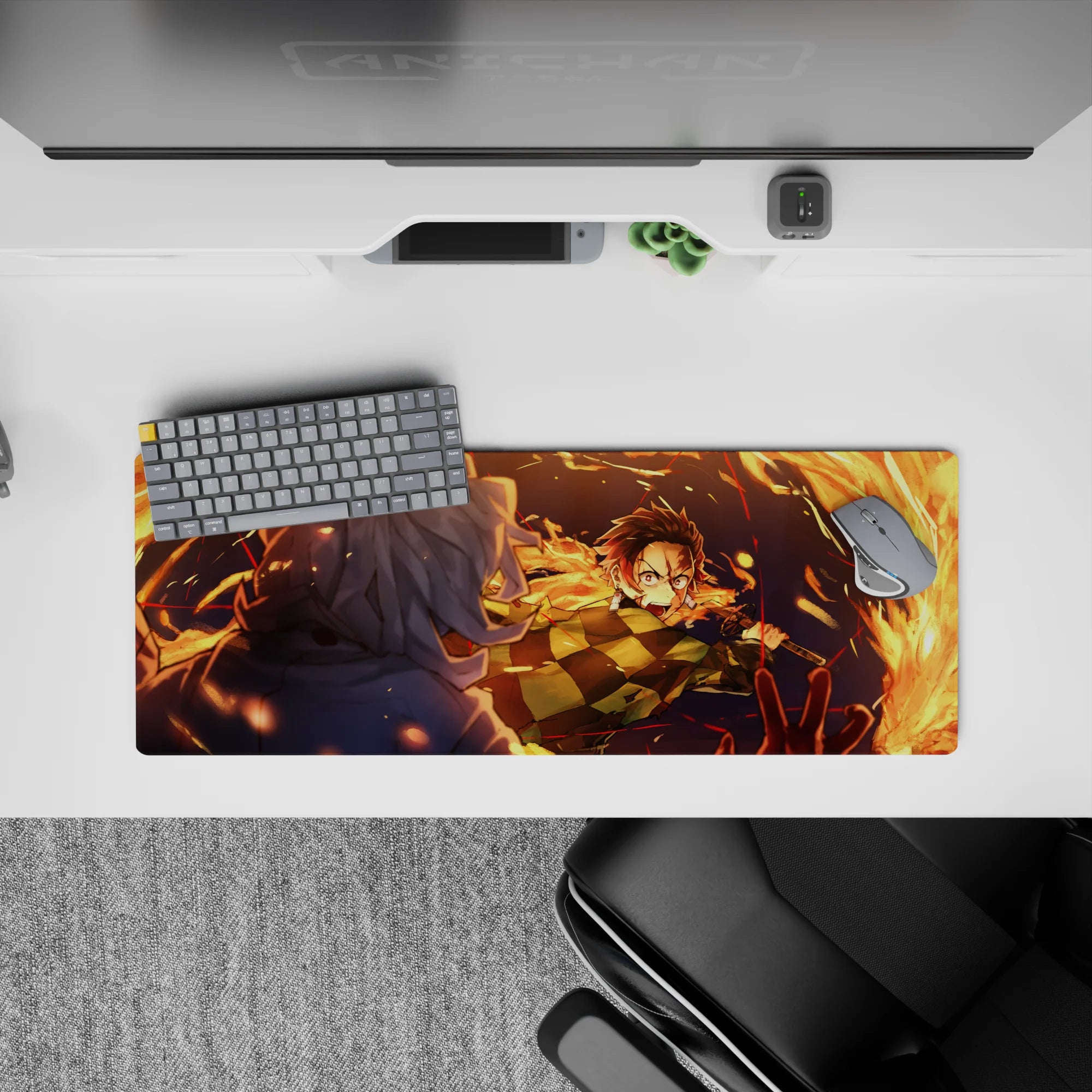 Anime mouse pad 32x12 inches featuring Tanjiro Kamado in action with fiery orange arcs against a deep blue night.