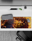 Anime mouse pad 32x12 inches featuring Tanjiro Kamado in action with fiery orange arcs against a deep blue night.