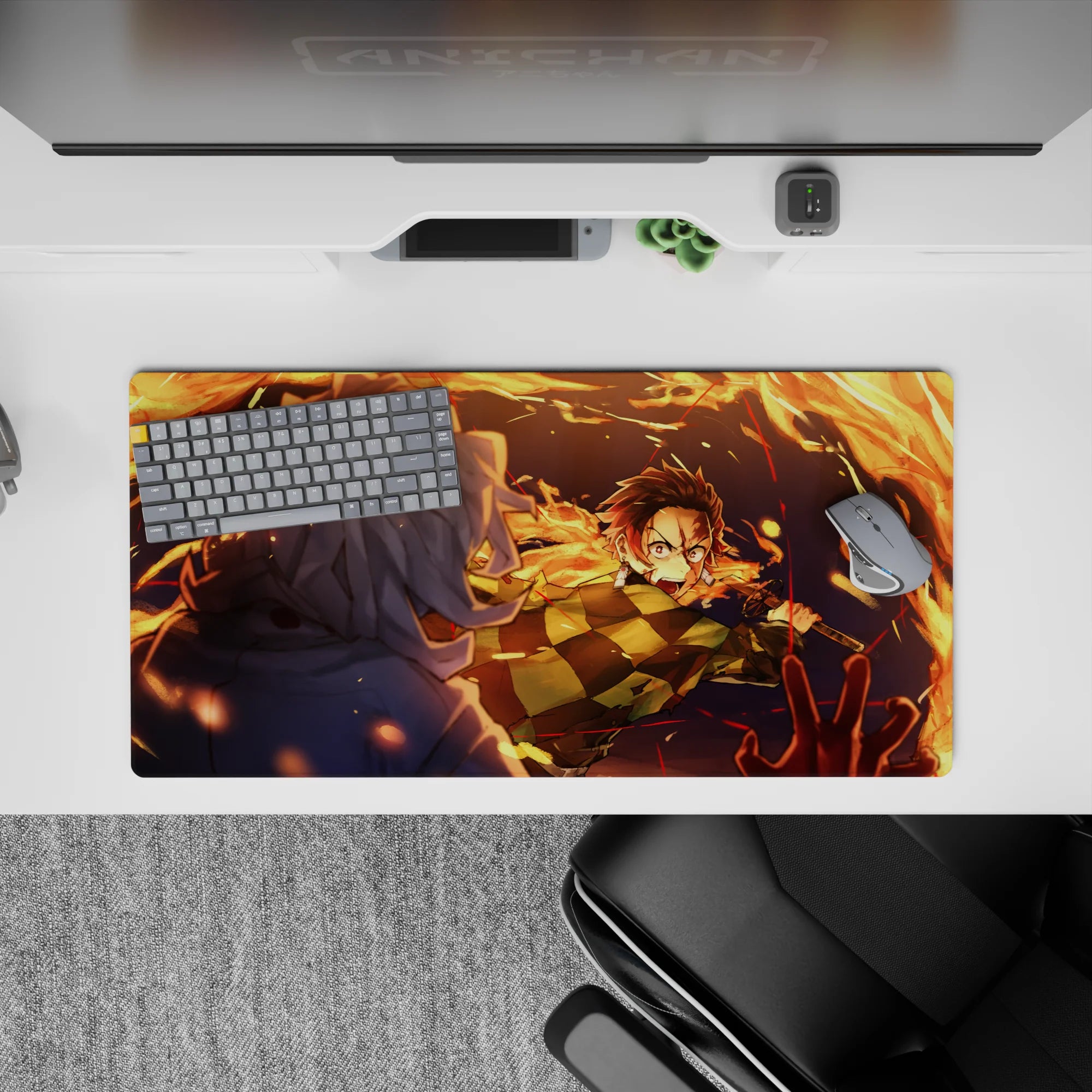 Anime mouse pad 32x16 inches featuring Tanjiro Kamado in action, surrounded by vivid orange flames against a dark blue night.
