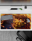 Anime mouse pad 32x16 inches featuring Tanjiro Kamado in action, surrounded by vivid orange flames against a dark blue night.
