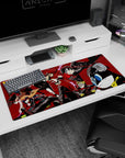 Persona 5 desk pad 36x16 inches featuring Joker, Panther, and Mona in a dynamic heist scene with vibrant reds and blacks.